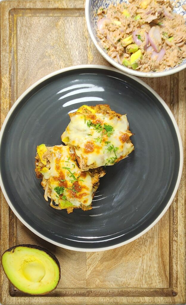 tuna melt on toast with cut avocado and tuna mix