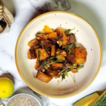 roast pumpkin with sage brown butter in a bowl