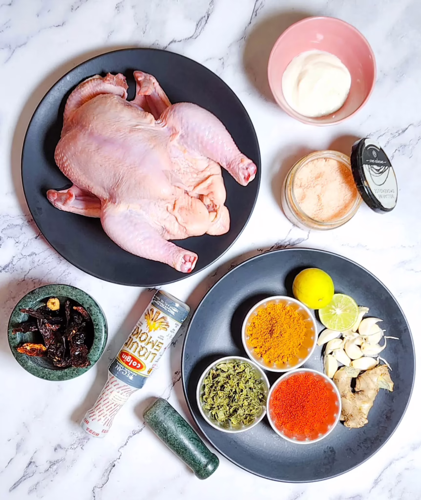 Whole Roast Chicken Tikka Recipe ingredients garlic, fenugreek leaves, garam masala powder, yoghurt, salt, lime, ginger, chilli powder, liquid smoke